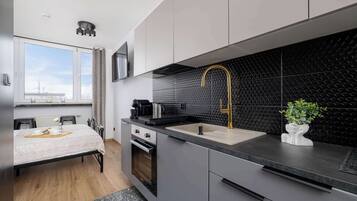 Fridge, stovetop, coffee/tea maker, cookware/dishes/utensils