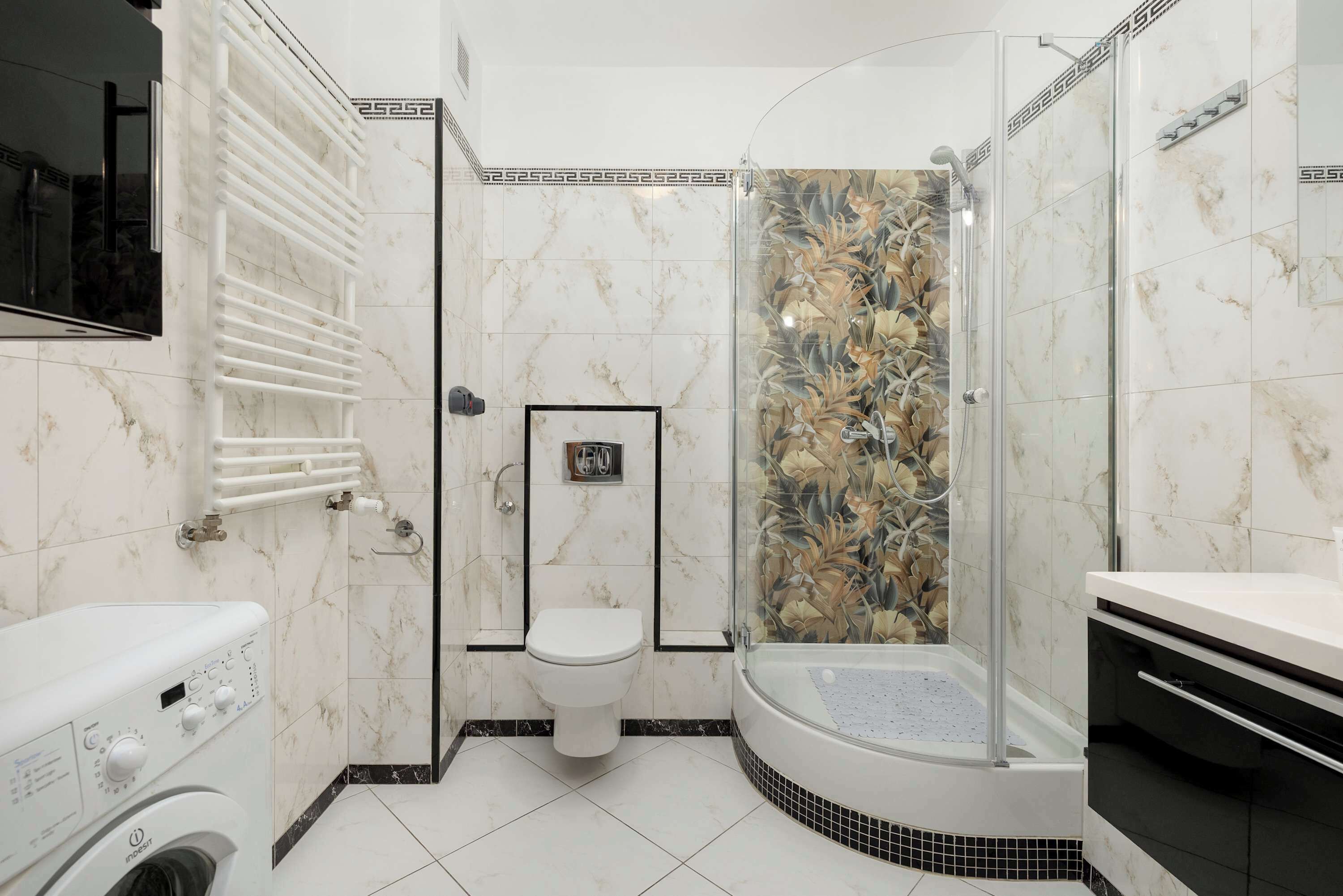 Shower, hair dryer, towels, shampoo