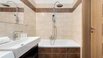 Shower, hair dryer, towels, shampoo