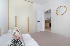 1 bedroom, desk, iron/ironing board, travel crib