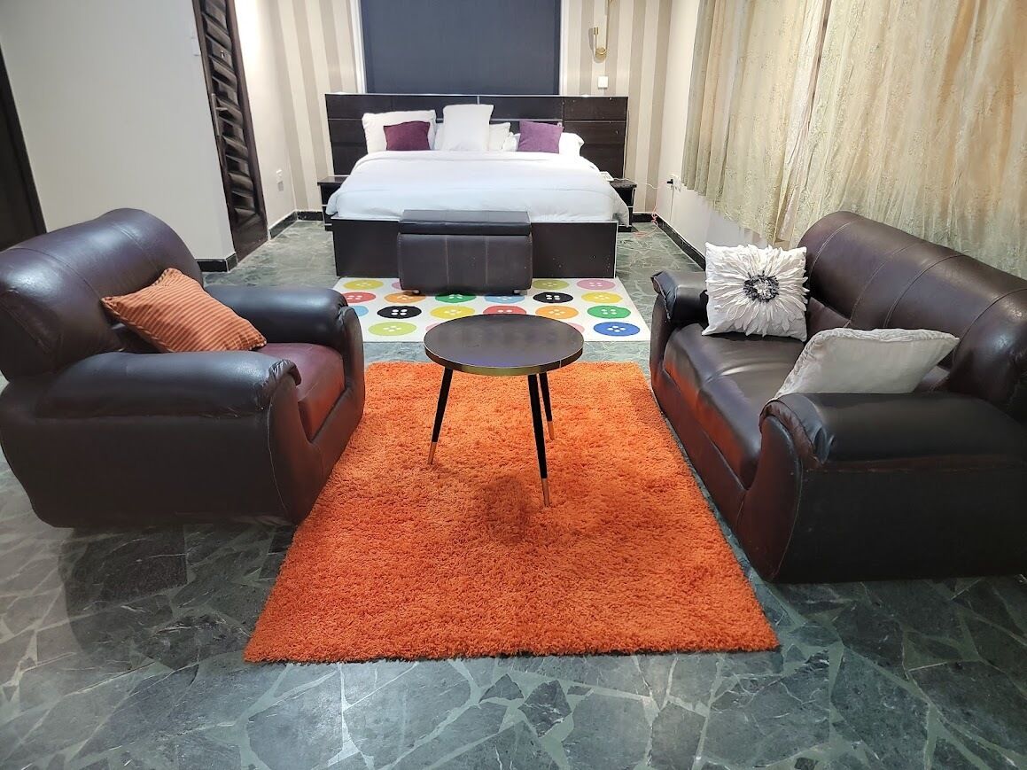 Departamento Deluxe, para no fumadores, vista a la ciudad | Área de sala de estar