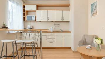 Fridge, microwave, stovetop, coffee/tea maker