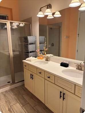 Shower, hair dryer, towels, soap