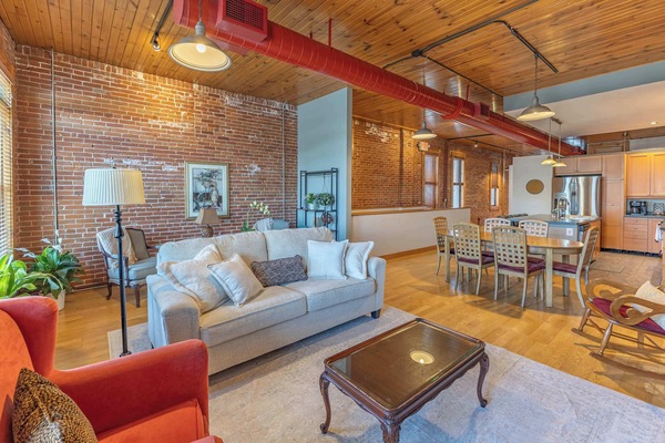 Open concept living room with queen pull out couch for additional guests.