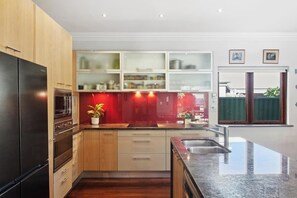 Fridge, coffee/tea maker, cookware/dishes/utensils