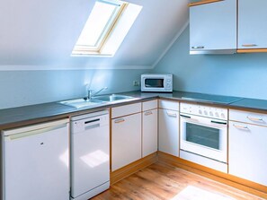 Fridge, oven, coffee/tea maker, cookware/dishes/utensils