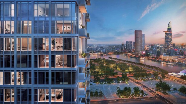 A modern high-rise building with multiple balconies and large windows, overlooking a river and a cityscape with prominent skyscrapers. - Luxury Apartment Hotel - The Metropole (Ho Chi Minh City)