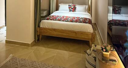 Wakih homes! Cozy studio, 15 mins away from JKIA and 7 minutes away from SGR