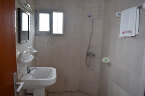 Shower, slippers, towels, soap