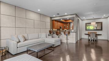 Apartment, City View | Living area | Flat-screen TV