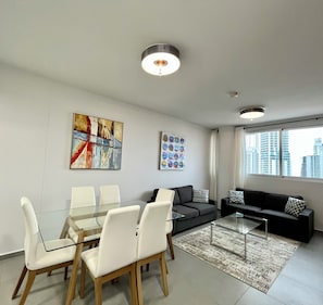 Luxury Condo, Ocean View (103) | Living area | 126-cm TV with cable channels