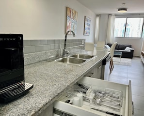 Luxury Condo, Ocean View (103) | Private kitchen | Fridge, microwave, oven, stovetop