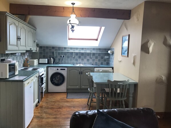 Fridge, high chair, cookware/dishes/utensils