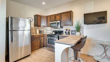 Fridge, microwave, coffee/tea maker, cookware/dishes/utensils