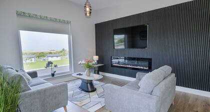 NUMBER 6 VILLA - THE VIEW, with a garden in Derrybeg, County Donegal