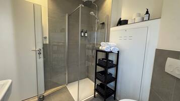 Shower, hair dryer, towels, soap