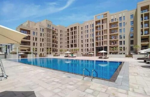 Luxury 2BR w/ Pool, Gym & Balcony – Zahra Breeze