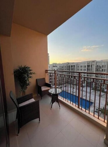 Luxury 2BR w/ Pool, Gym & Balcony – Zahra Breeze