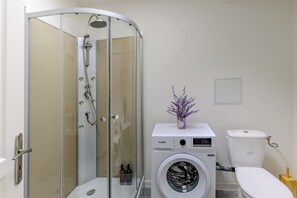 Shower, hair dryer, towels