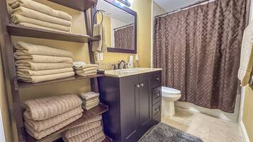 Jetted bath, towels, soap, toilet paper