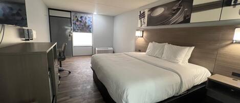 Premium bedding, desk, laptop workspace, free WiFi