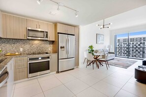 Fridge, microwave, coffee/tea maker, cookware/dishes/utensils