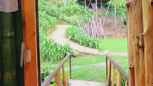 A wooden staircase leading outside with a green mat at the bottom. - El Pital  (San Ignacio)