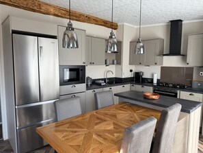 Fridge, microwave, oven, cookware/dishes/utensils