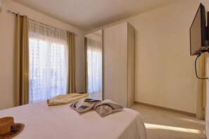 Iron/ironing board, travel crib, free WiFi, bed sheets