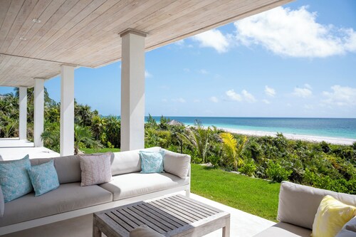 Contemporary Beachfront Escape with Private Pool on Windermere's World-Famous Pink Sand Beach