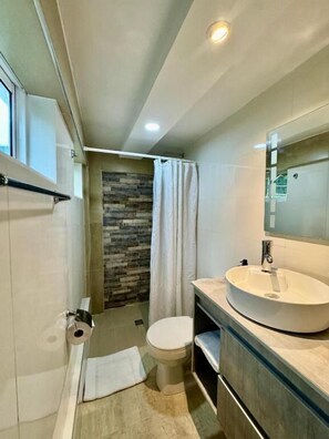 Shower, hair dryer, towels, soap