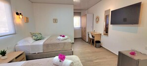 Family Quadruple Room, 2 Queen Beds, Private Bathroom | In-room safe, laptop workspace, blackout curtains, iron/ironing board