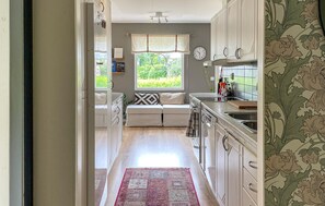 Fridge, stovetop, dishwasher, coffee/tea maker