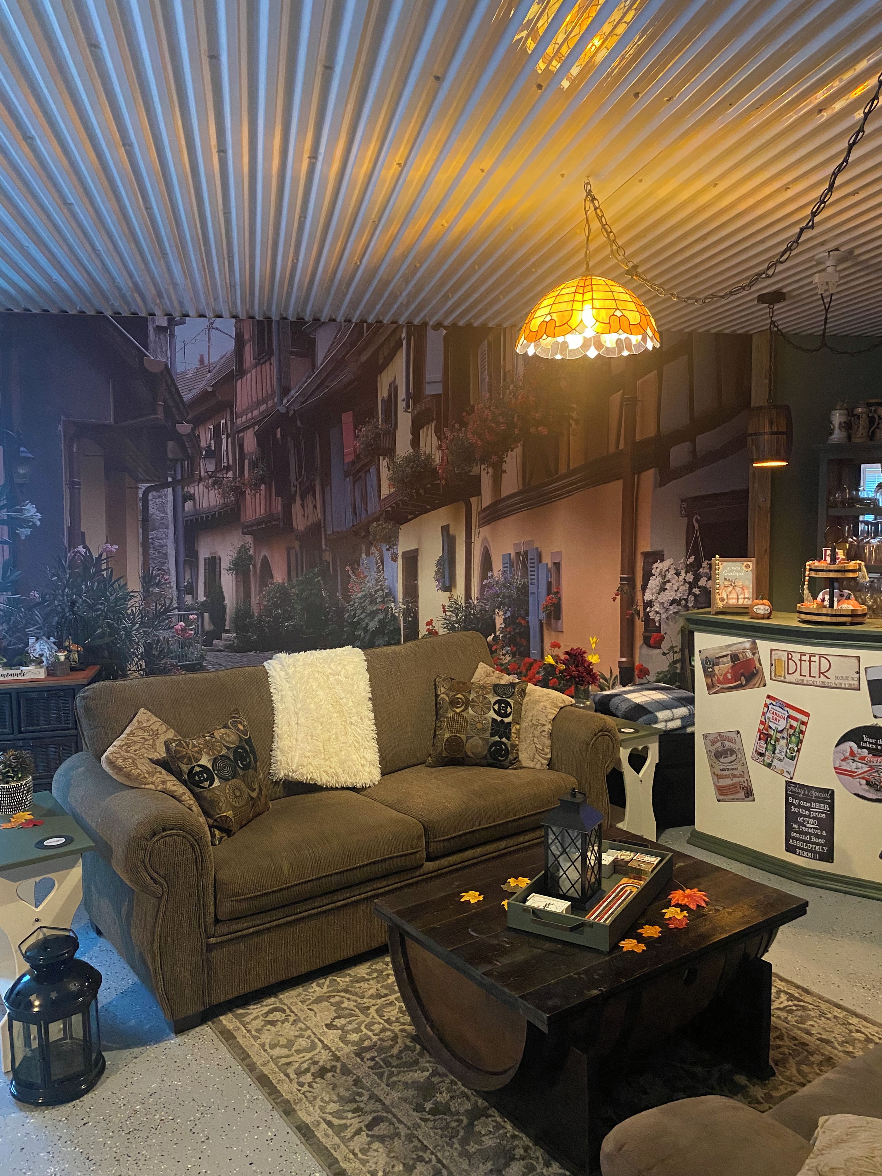 A cozy living room with a sofa, coffee table, and decorative items.