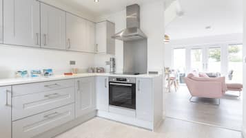 Fridge, microwave, toaster, dining tables