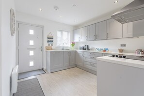 Fridge, microwave, toaster, dining tables