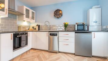 Fridge, microwave, toaster, dining tables