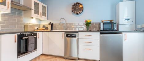 Fridge, microwave, toaster, dining tables