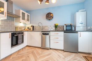 Fridge, microwave, toaster, dining tables