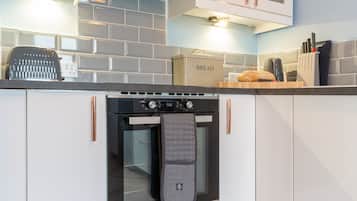 Fridge, microwave, toaster, dining tables