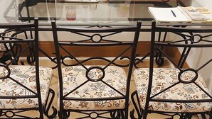 A dining table with a coffee maker, microwave, and food items. - The Williams Center (New London)