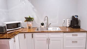 Fridge, microwave, coffee/tea maker, toaster