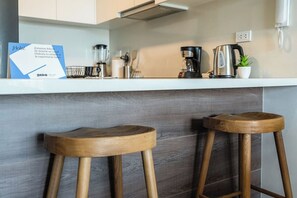 Fridge, microwave, stovetop, coffee/tea maker