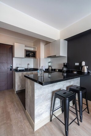 Fridge, microwave, stovetop, coffee/tea maker