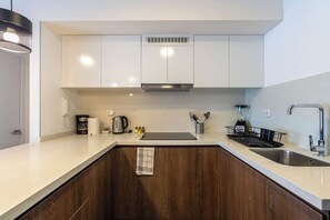 Fridge, microwave, stovetop, coffee/tea maker