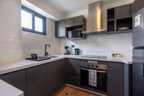 Fridge, microwave, stovetop, coffee/tea maker