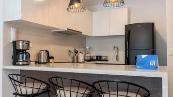 Fridge, microwave, stovetop, coffee/tea maker