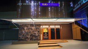 A hotel entrance with a sign indicating rooms are available. - FabHotel Joy Residency (Chennai)