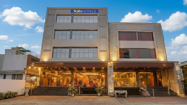 A modern hotel building with a sign reading "fabHOTELS". - Fabhotel Golden Rivaah (Ghaziabad)