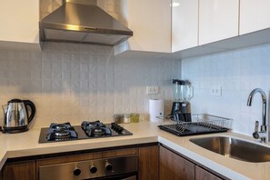 Fridge, microwave, stovetop, coffee/tea maker